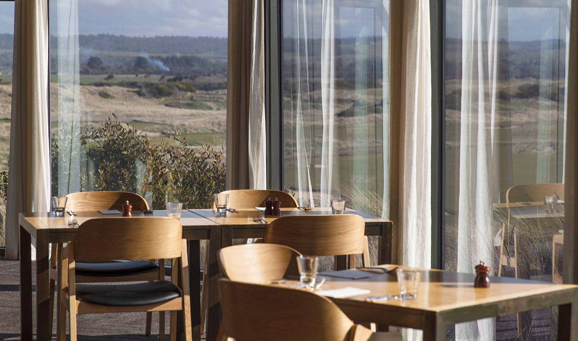 the incredible view and dining room at the barnbougle lost farm